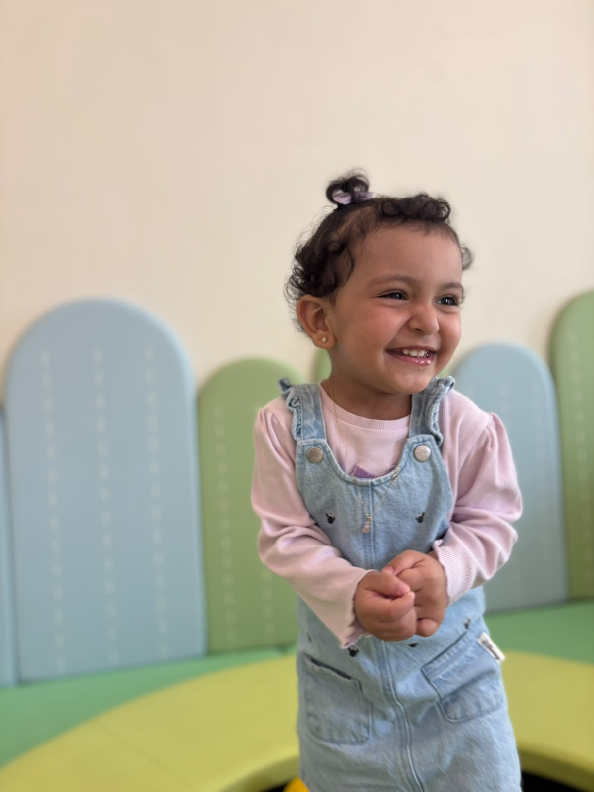 Smiling girl in the soft-play room